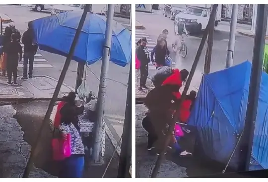 Mujer tira a vendedora de tamales