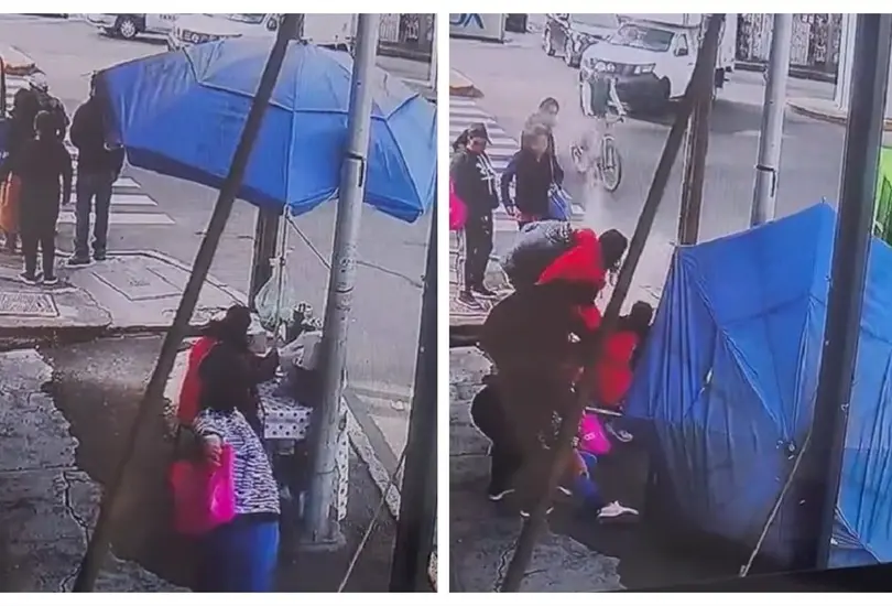 Mujer tira a vendedora de tamales
