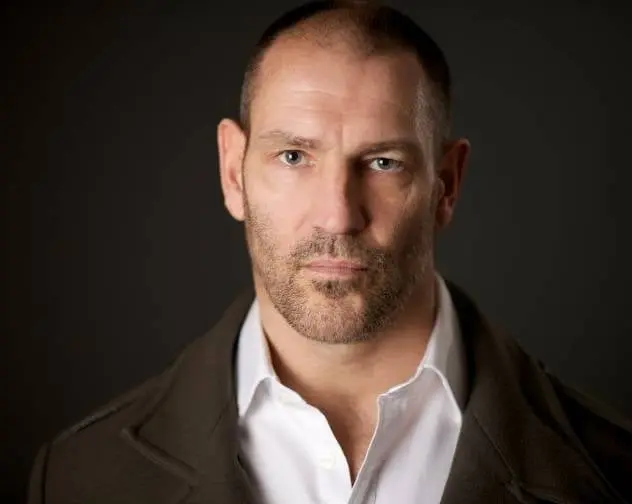 Interpretó a Fenrir Greyback, el hombre lobo. 