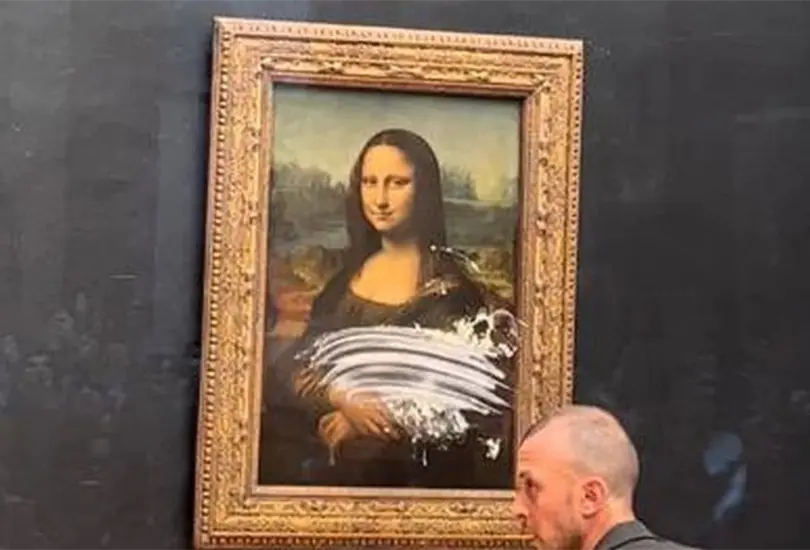 Lanzan pastelazo a la Mona Lisa en el museo del Louvre en protesta por el cambio clim&aacute;tico | VIDEOS