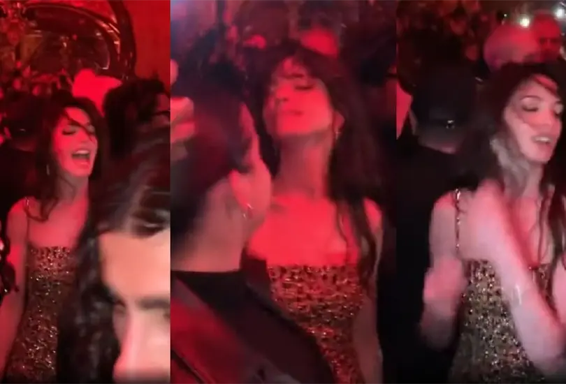 Anne Hathaway hipnotiz&oacute; a todos con su vestido dorado y sus pasos de baile en una fiesta privada de la Fashion Week de 2023.
