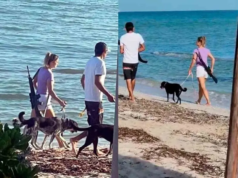 Captan a mujer extranjera caminando por la playa con un rifle. Captan a mujer extranjera caminando por la playa con un rifle.
