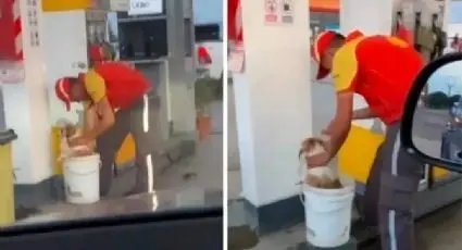  Empleado de gasolinera ba&ntilde;a a lomito para que no le d&eacute; un golpe de calor. 