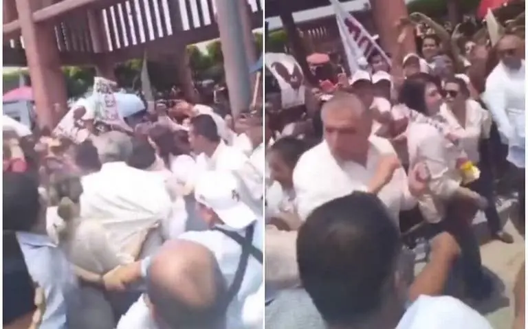 Ad&aacute;n Augusto le da un codazo a la diputada Karla Rabelo Estrada. 