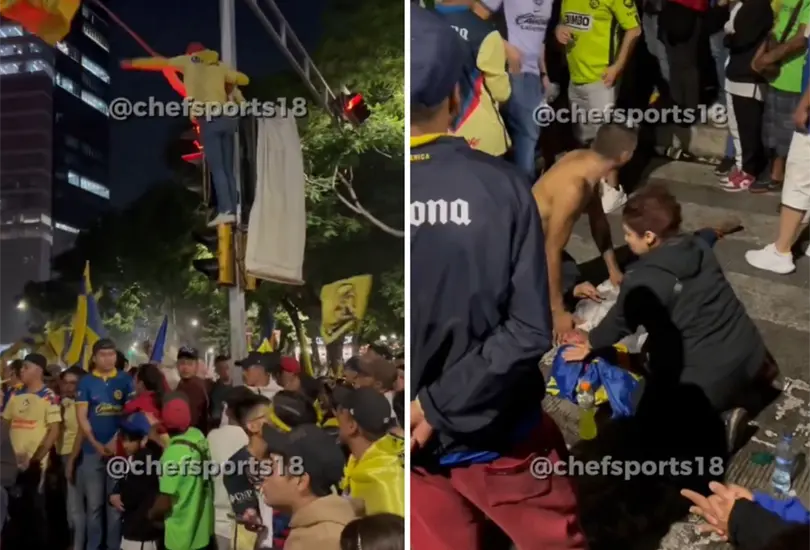 Aficionado del Am&eacute;rica se sube a sem&aacute;foro y cae en festejos en el &Aacute;ngel. 