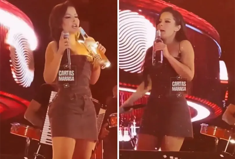 Cantante confunde micrófono con botella. Cantante confunde micrófono con botella.