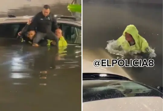 El policía se sumergió en las aguas negras para liberar al conductor. El policía se sumergió en las aguas negras para liberar al conductor.
