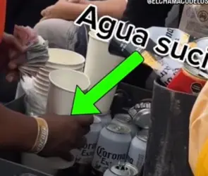 Exhiben a vendedor rebajando cerveza con agua sucia en la Nascar México 2025