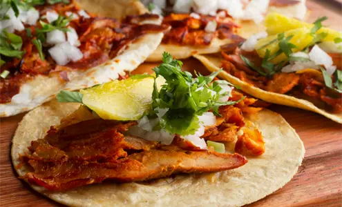 El taco al pastor: la tradición que nació en las calles chilangas y conquistó a todo México El taco al pastor: la tradición que nació en las calles chilangas y conquistó a todo México